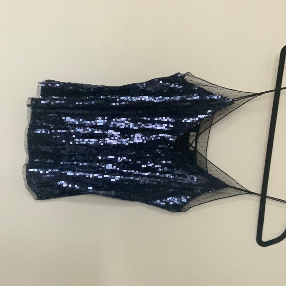 Pretty blue sequin top with black netting trim